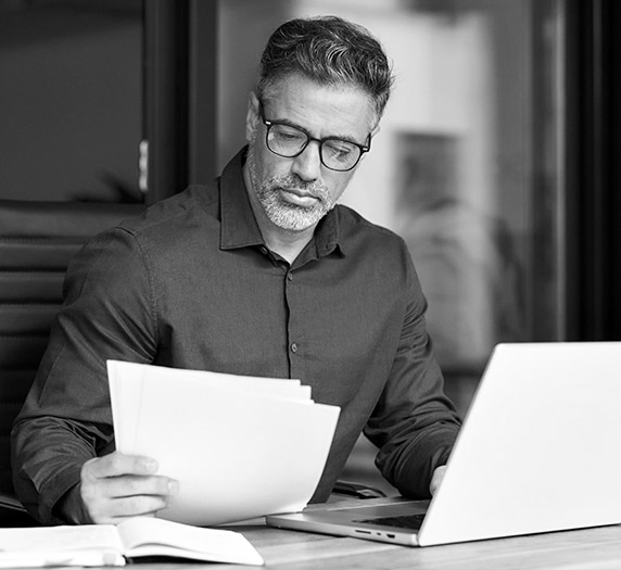a man looking at papers